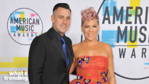 Pink and Carey Hart posing on the red carpet at the American Music Awards