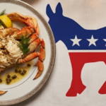 Cooked crab garnished with lemon and dill on a plate next to the Democratic Party donkey symbol with stars.