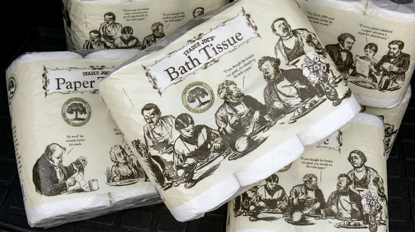 Trader Joe's Bath Tissue and Paper Towels packages with vintage-style black and white illustrations and humorous quotes.