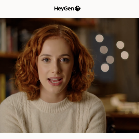 Young woman with curly red hair speaking in a cozy room with bookshelves and warm lighting in the background