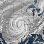 Satellite image showing a large swirling storm system over the central United States.