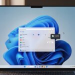 Laptop screen displaying Windows 11 desktop with a search window open and Copilot feature highlighted