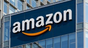 Amazon logo on the exterior of a modern glass office building
