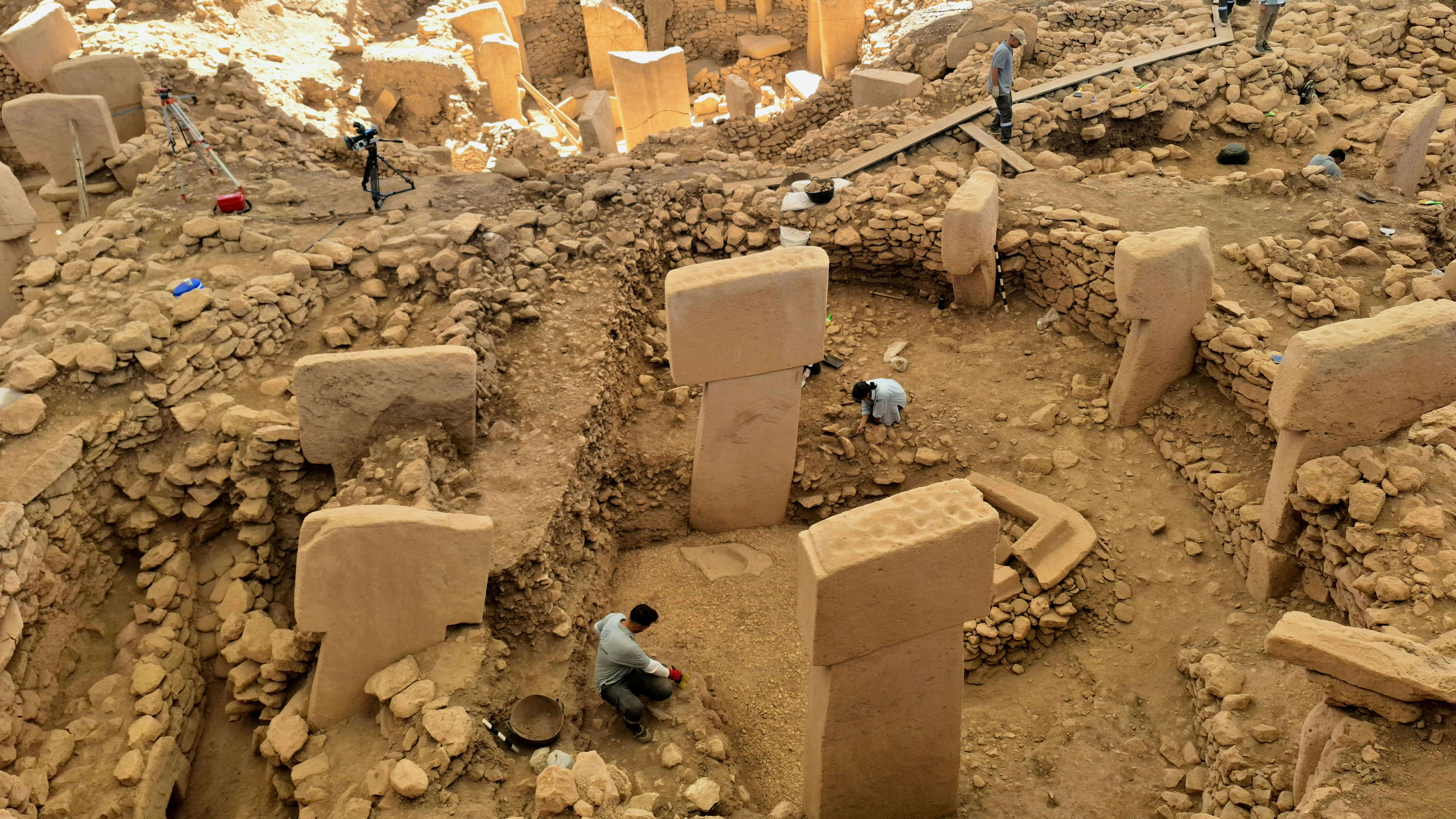 Archaeologists excavating ancient stone pillars at the Göbekli Tepe archaeological site in Turkey.