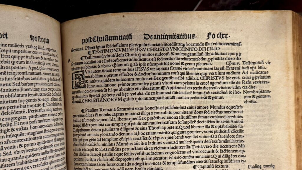 Page from an old Latin book discussing the testimony of Jesus Christ and early Christian history.