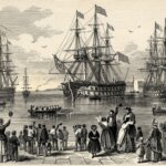Crowd of 19th-century people waving at three large sailing ships docked in a harbor with rowboats nearby.