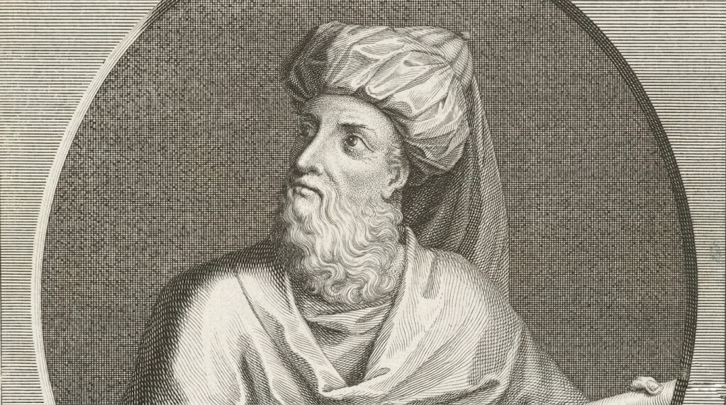 Engraving of an ancient bearded man wearing a turban and robe, holding a scroll, looking upward.
