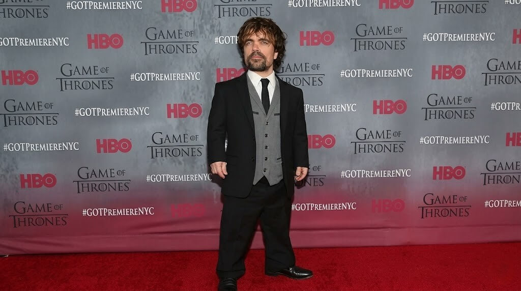 Peter Dinklage in a black suit and gray vest at the Game of Thrones HBO premiere in New York City.