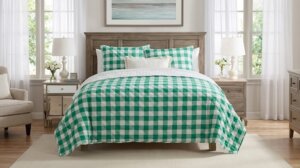 Bed with green and white checkered bedding in a bright bedroom with wooden furniture and white curtains.