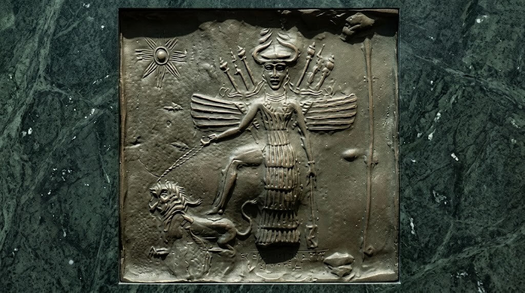 Bronze relief of the Mesopotamian god with wings, horned headdress, and lion underfoot, known as the Burney Relief.