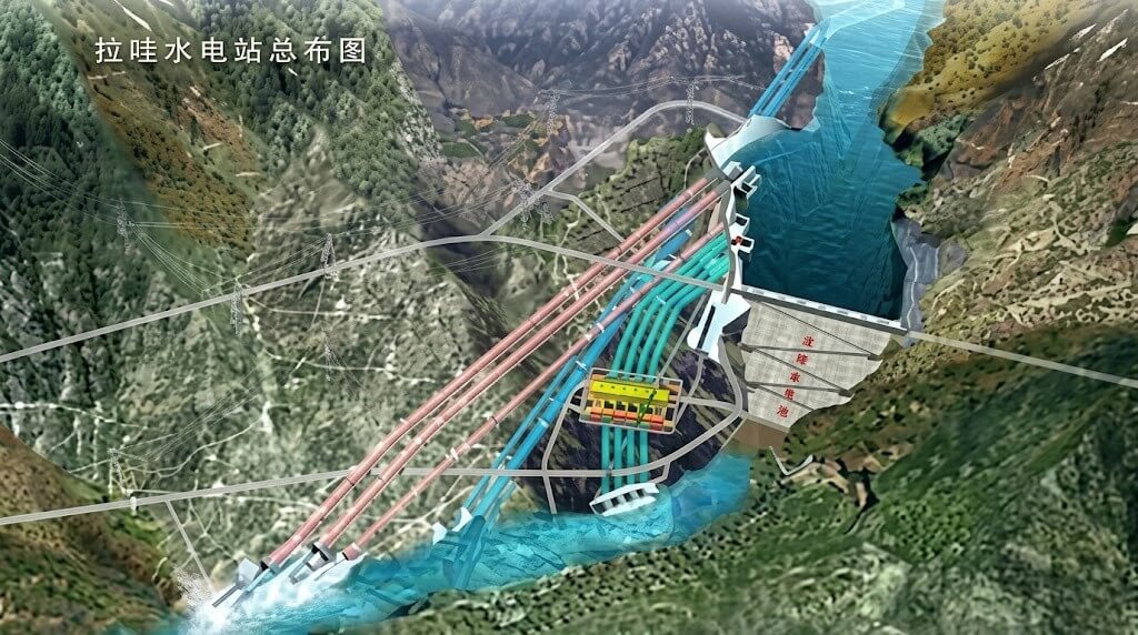 Aerial view of the La Wa Hydropower Station with dam, water flow, and transmission lines in a mountainous area.