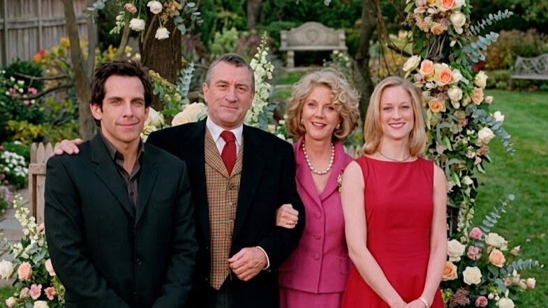 Ben Stiller, Robert De Niro, Diane Keaton, and Tea Leoni posing together at a garden event with floral decorations.