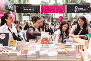 People browsing books at a Pocket booth during the 10/18 book fair event