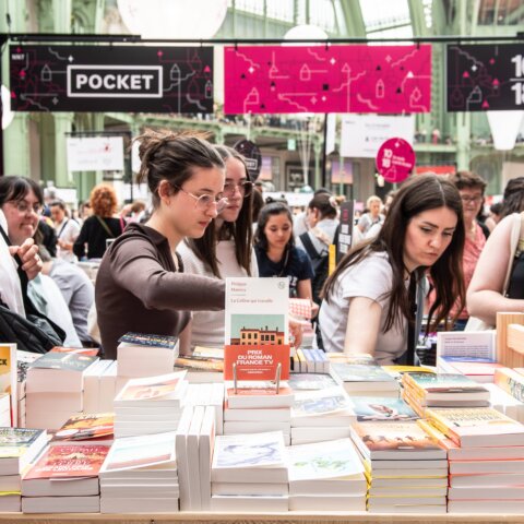 People browsing books at a Pocket booth during the 10/18 book fair event