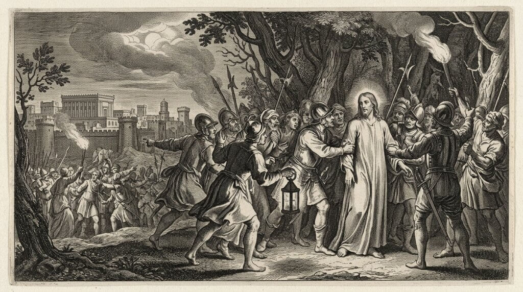 Jesus being arrested by soldiers in a wooded area at night with a city in the background
