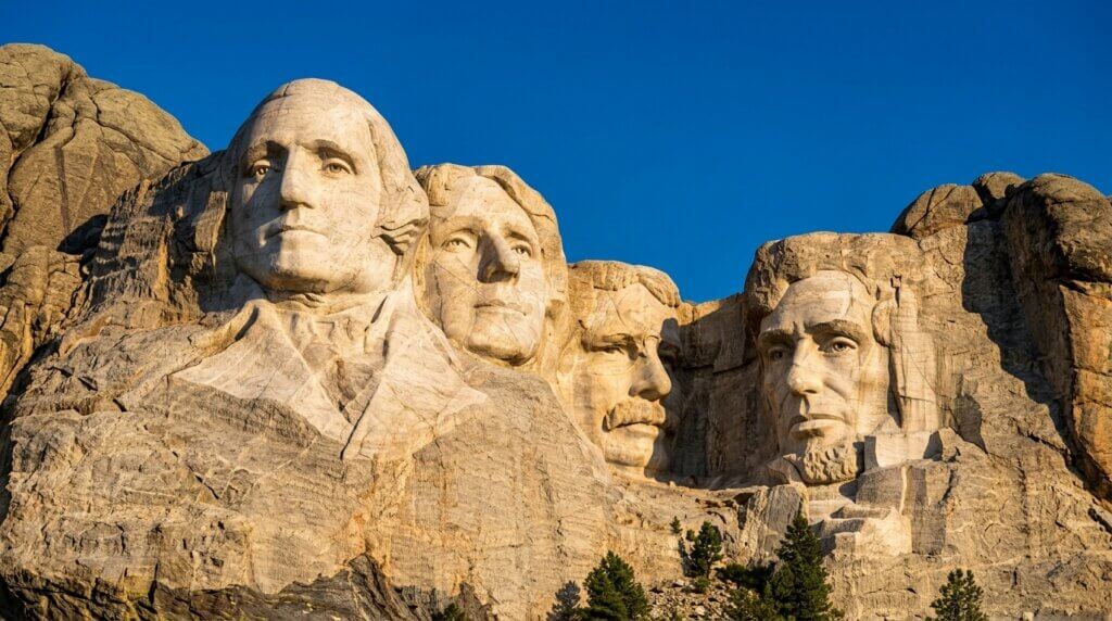 Mount Rushmore National Memorial featuring carved faces of George Washington, Thomas Jefferson, Theodore Roosevelt, and Abraham Lincoln