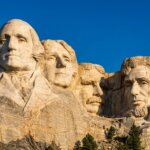 Mount Rushmore National Memorial featuring carved faces of George Washington, Thomas Jefferson, Theodore Roosevelt, and Abraham Lincoln
