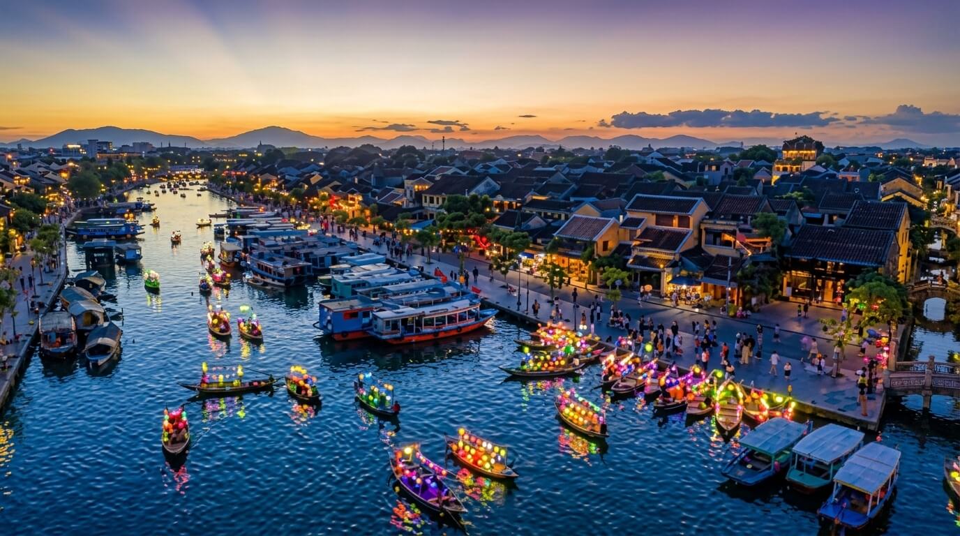 Boats decorated with colorful lanterns on a river at sunset in a bustling town with traditional buildings and crowds.