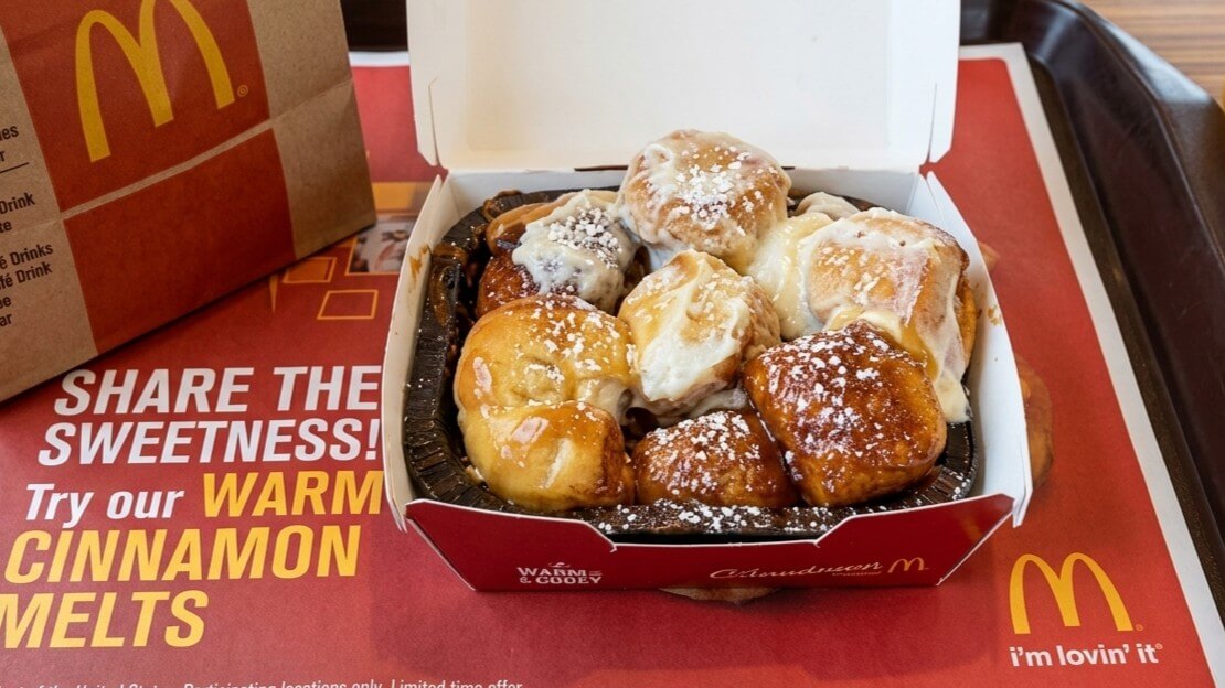 McDonald's warm cinnamon melts in a red box on a promotional tray mat.