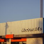 McDonald's restaurant exterior with golden arches logo at sunset