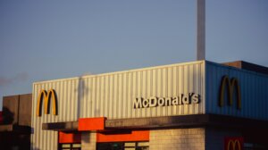 McDonald's restaurant exterior with golden arches logo at sunset