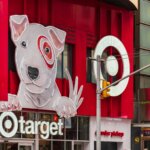 Target store entrance with large dog mascot sign and red branding in an urban setting