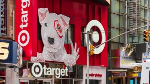 Target store entrance with large dog mascot sign and red branding in an urban setting