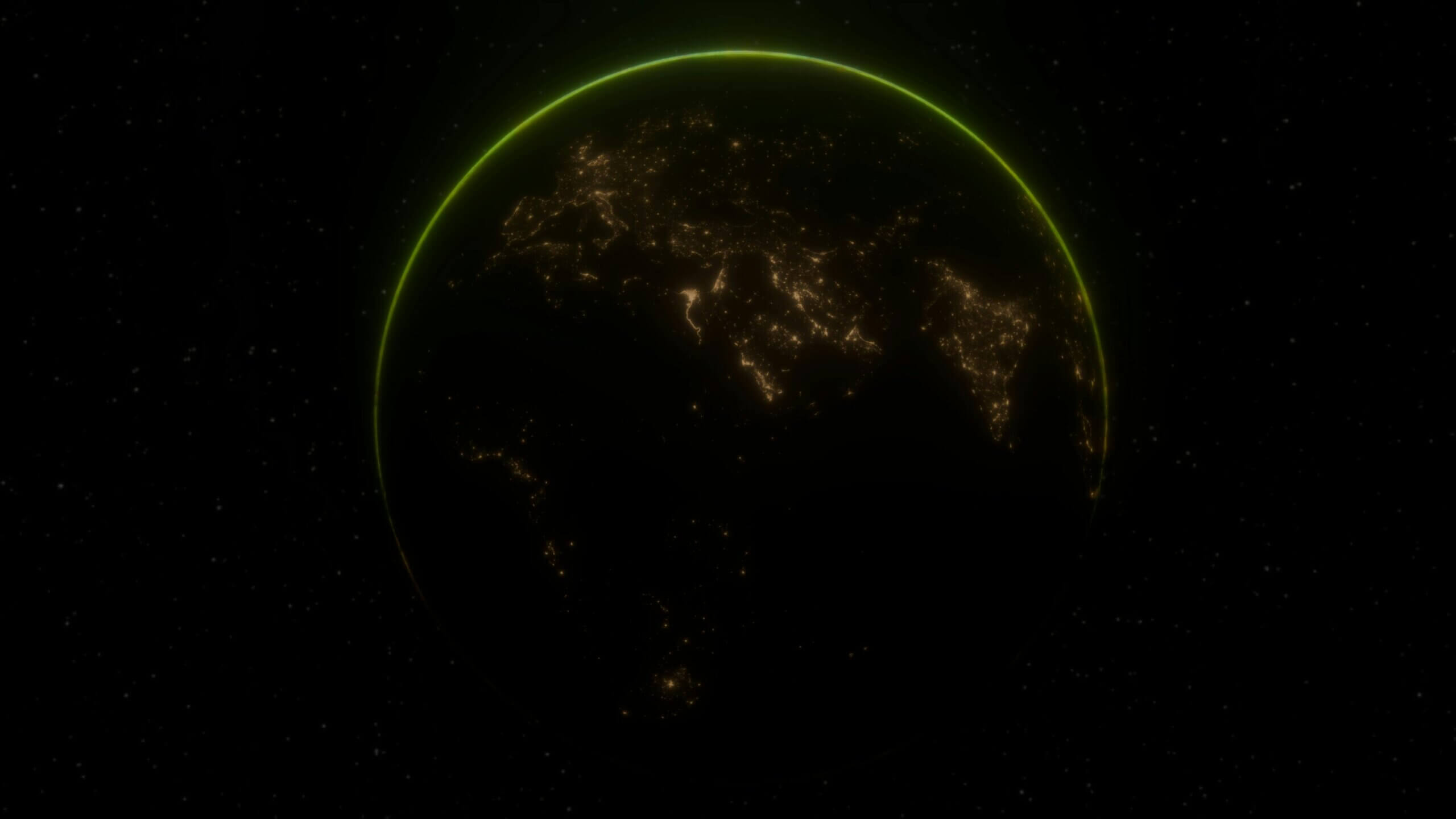 Earth at night showing illuminated cities with a green atmospheric glow on the horizon