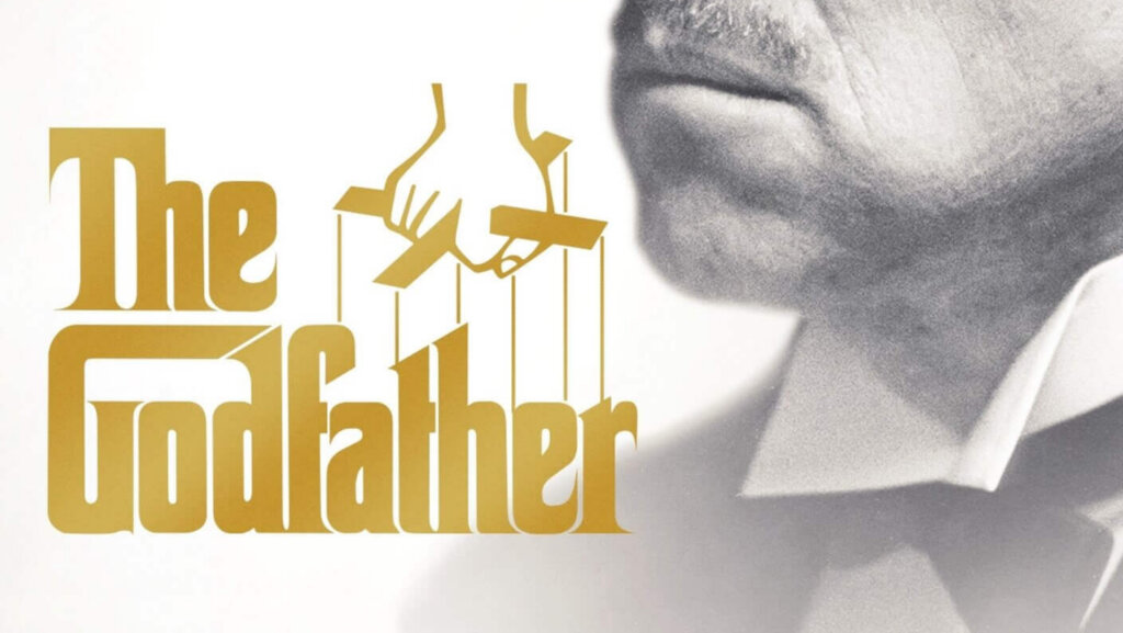 Marlon Brando as Vito Corleone in The Godfather movie poster with a bullet-riddled car and a man lying on the ground.