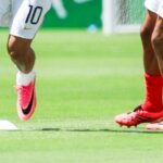 French national soccer team players warming up on the field before a match