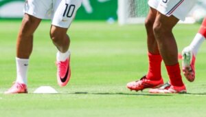 French national soccer team players warming up on the field before a match