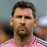 Lionel Messi wearing Inter Miami CF pink jersey with captain armband during a match