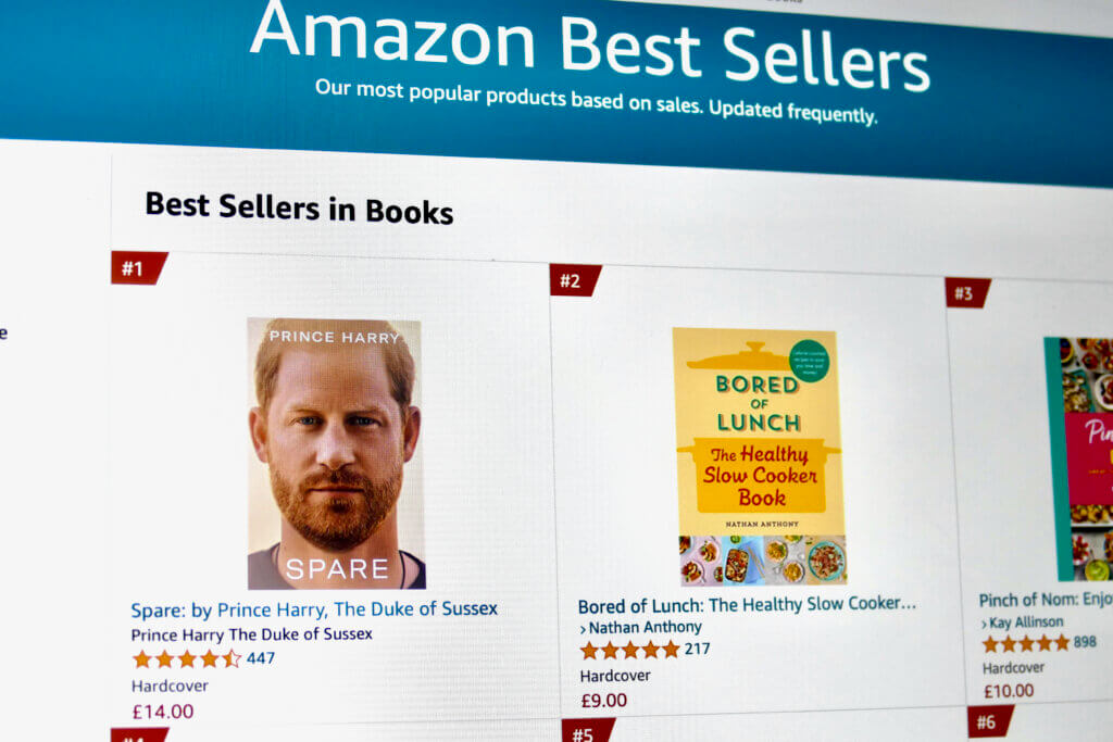 Amazon Best Sellers page showing top books including "Spare" by Prince Harry and "Bored of Lunch" by Nathan Anthony.
