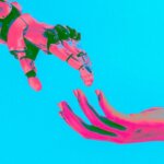Human hand reaching toward a robotic hand against a bright blue background with pink and green lighting effects
