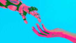 Human hand reaching toward a robotic hand against a bright blue background with pink and green lighting effects