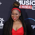 Actress Dara Reneé smiling on the red carpet at the High School Musical: The Musical: The Series premiere