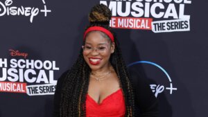 Actress Dara Reneé smiling on the red carpet at the High School Musical: The Musical: The Series premiere